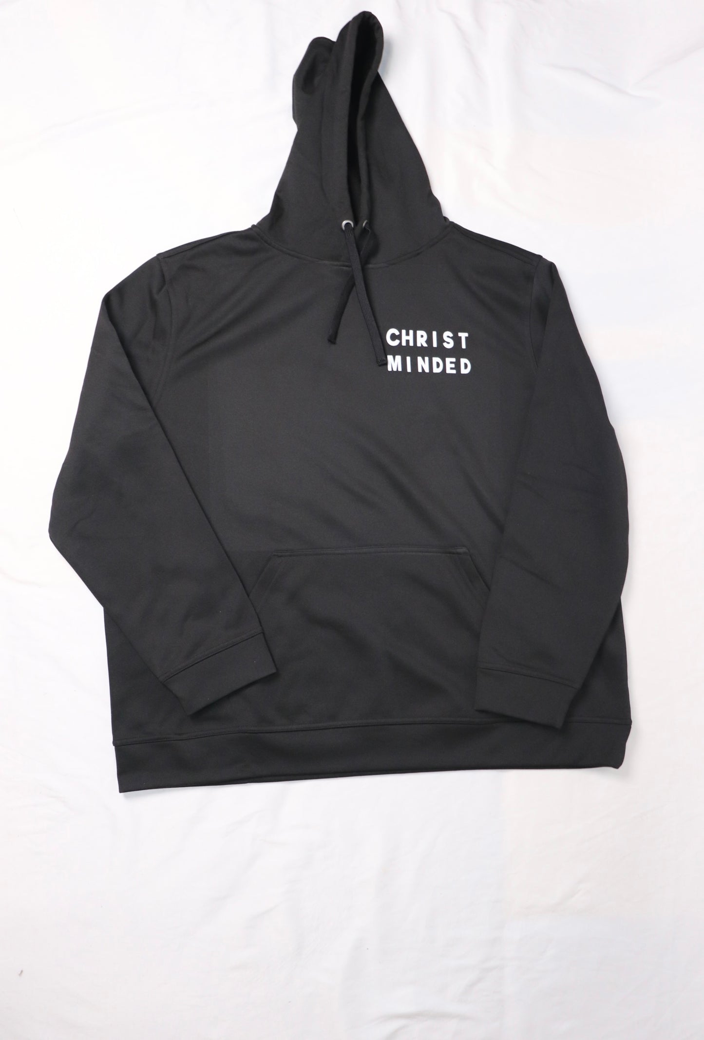 black Christ Minded hoodie with white lettering and black drawstrings laid flat on the white background
