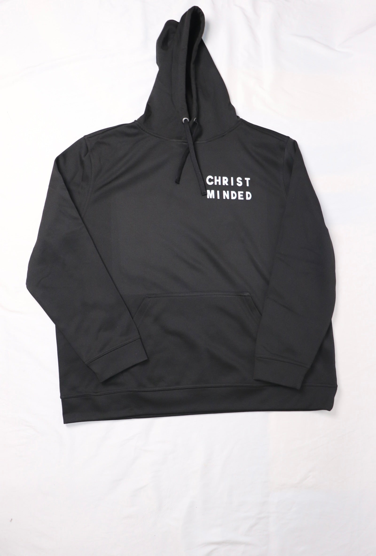 black Christ Minded hoodie with white lettering and black drawstrings laid flat on the white background
