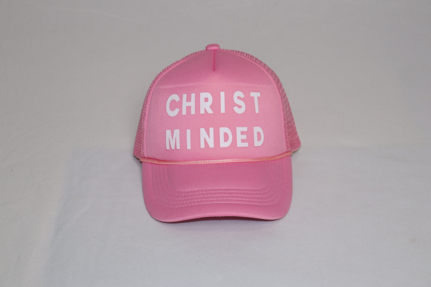 Pink Christian trucker hat with bold white “Christ Minded” lettering, symbolizing grace and renewal.