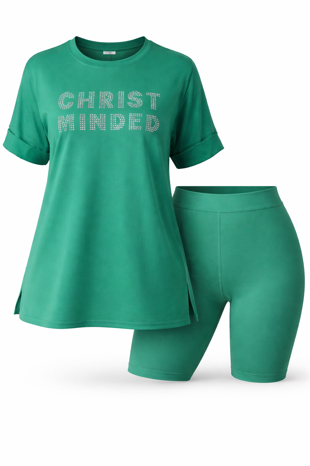 Woman wearing a green “Christ Minded” rhinestone shirt with matching biker shorts