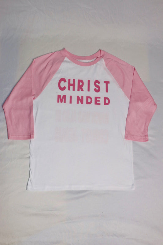 Christian baseball tee with pink sleeves and white body featuring bold “Christ Minded” design on front