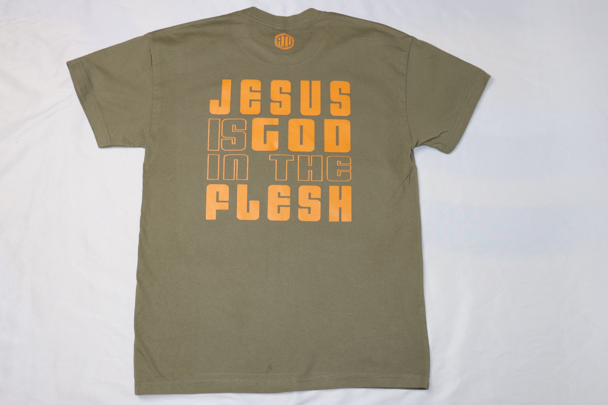 beige christian t-shirt with christ minded front design and Jesus is god in the flesh back print in blue letters
